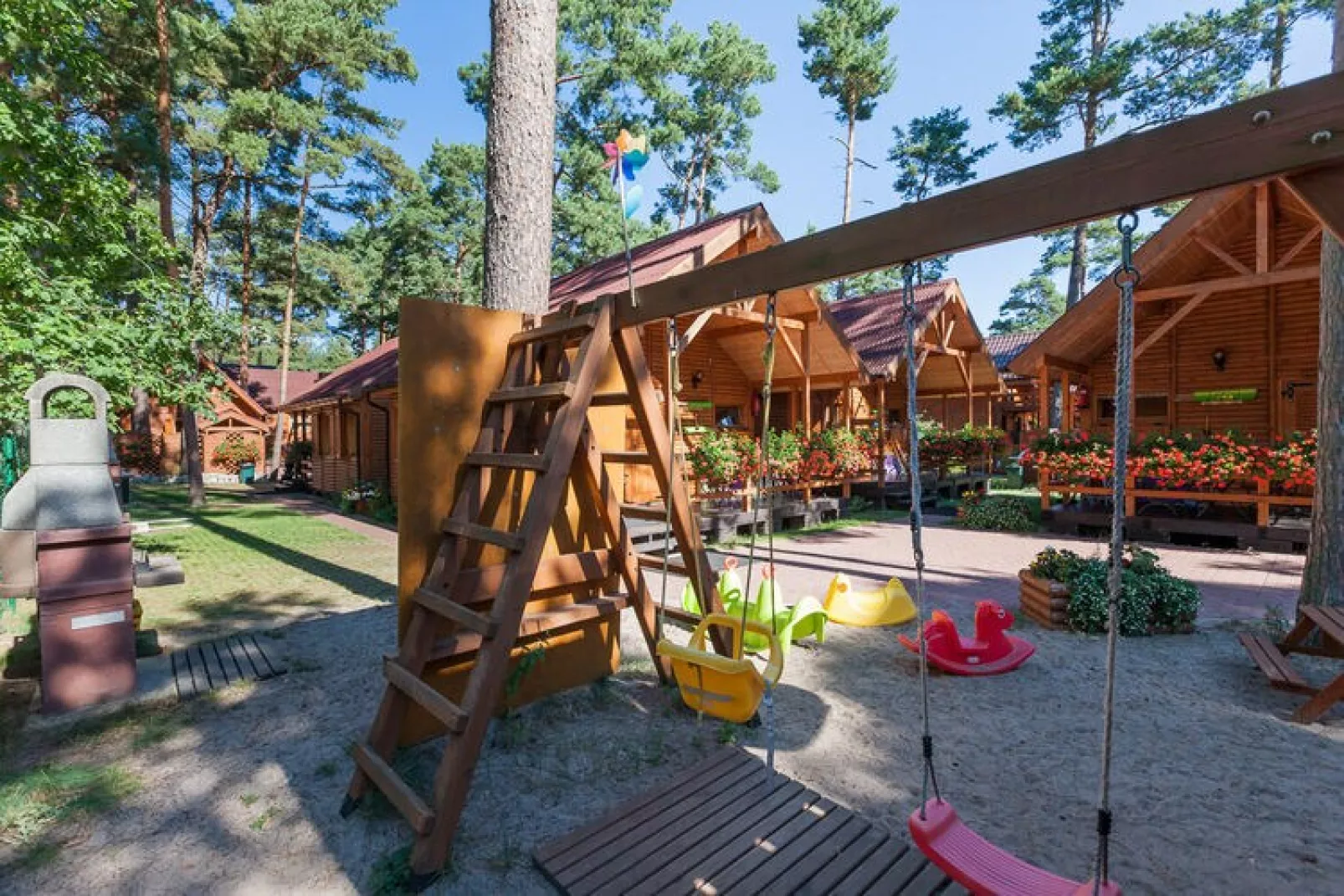 Domki letniskowe Pobierowo-Tuinen zomer