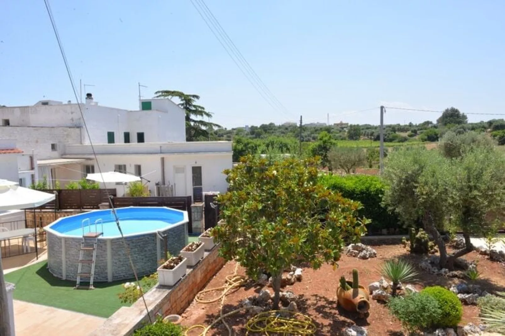 Trullo Cittadino Cisternino-Tuinen zomer