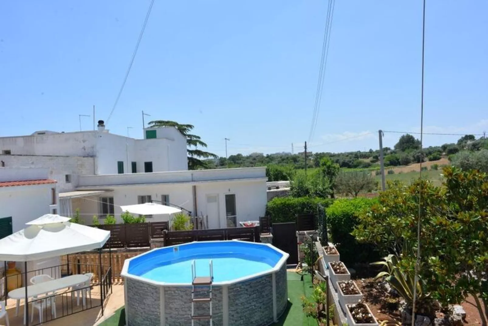 Trullo Cittadino Cisternino-Tuinen zomer