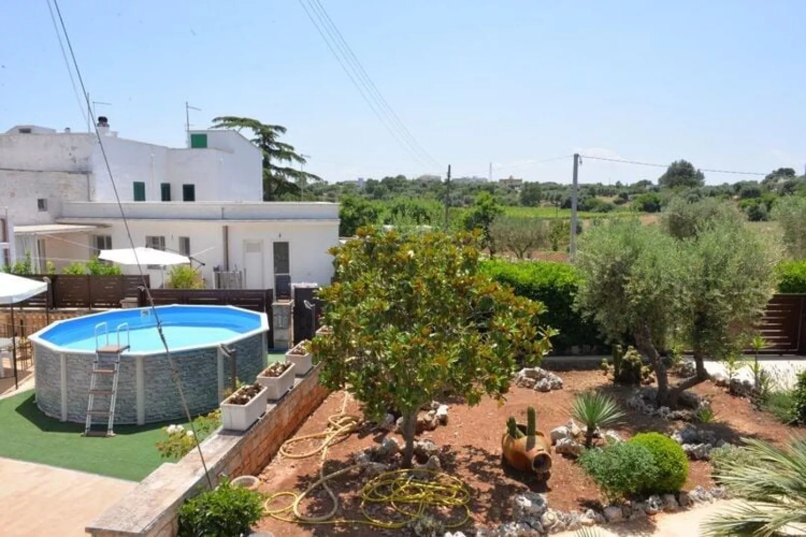 Trullo Cittadino Cisternino-Tuinen zomer