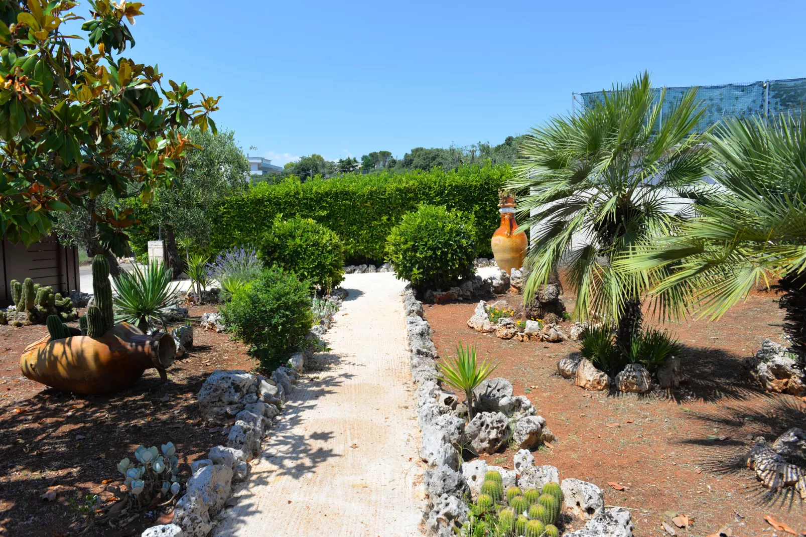 Trullo Cittadino Cisternino-Tuinen zomer