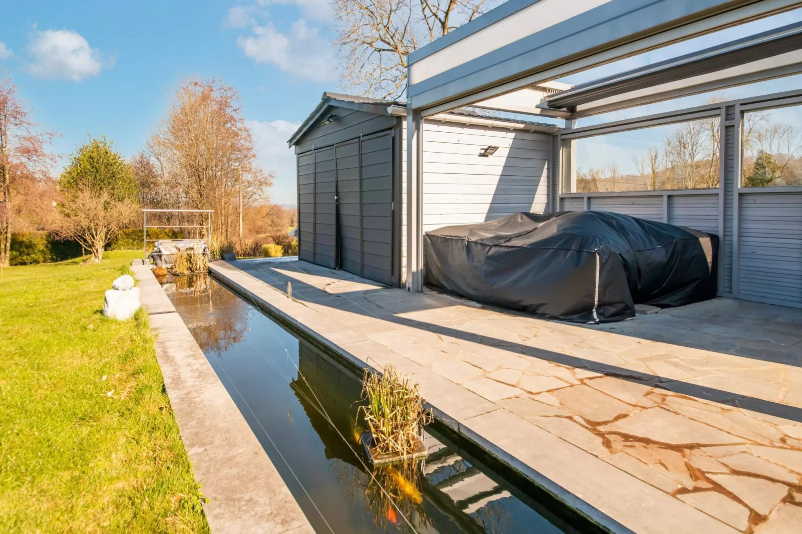 Charmante habitation située à la Reid avec Jacuzzi-Tuinen zomer