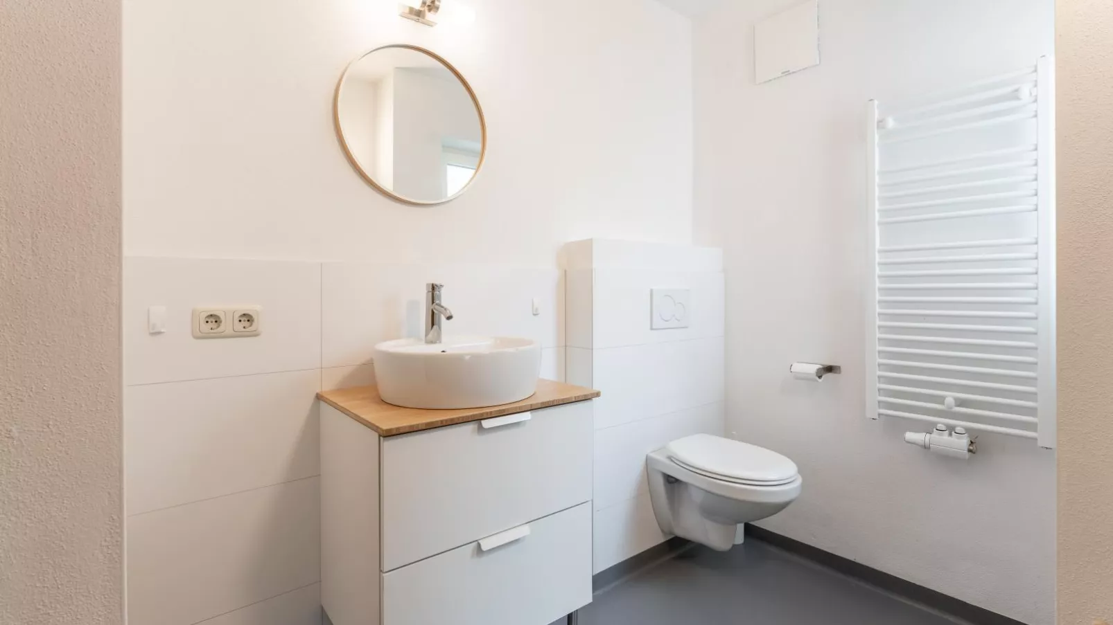 Heimelig L-Badkamer