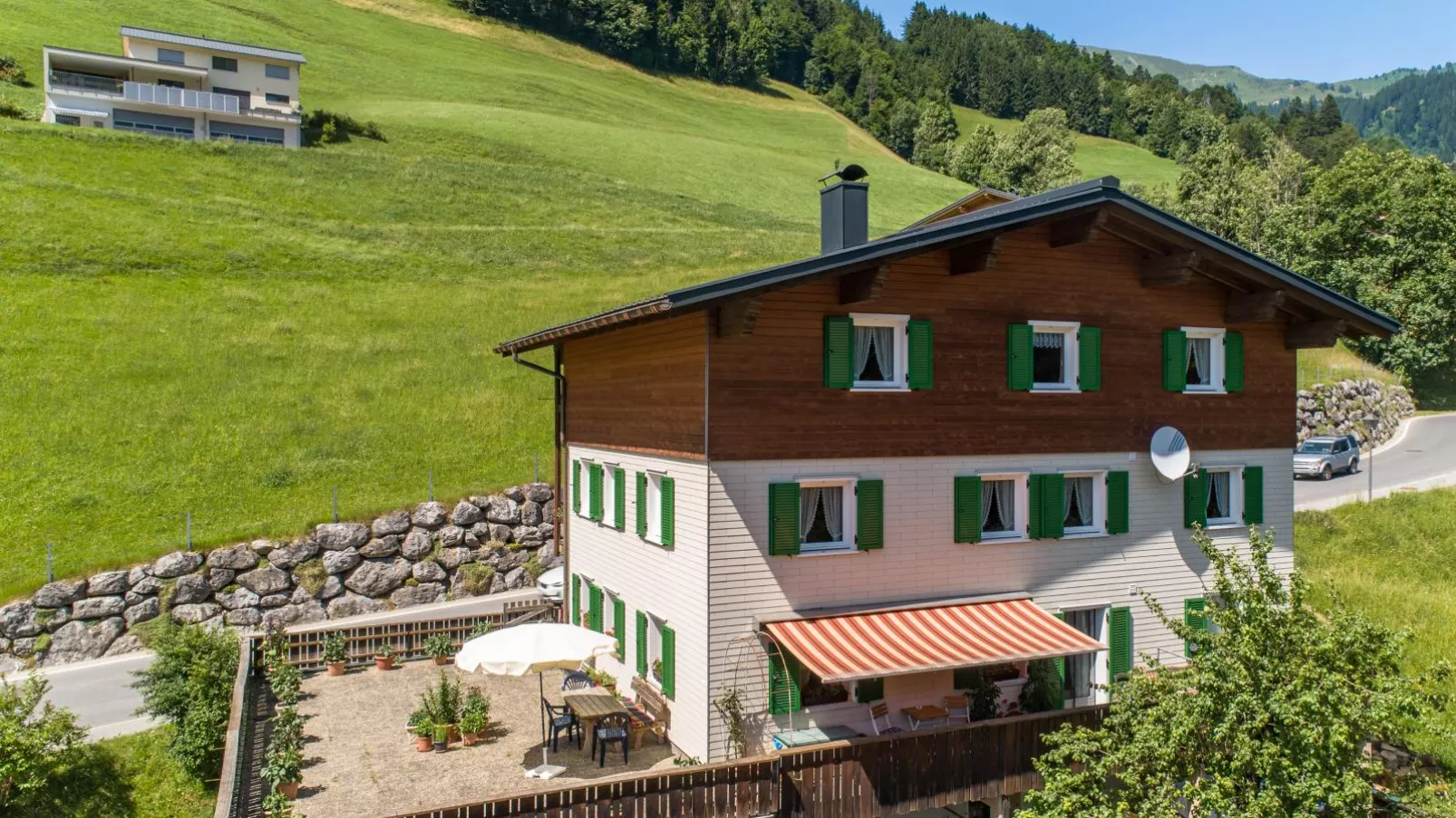 Ferienhaus Türtscher 1-Buitenkant zomer