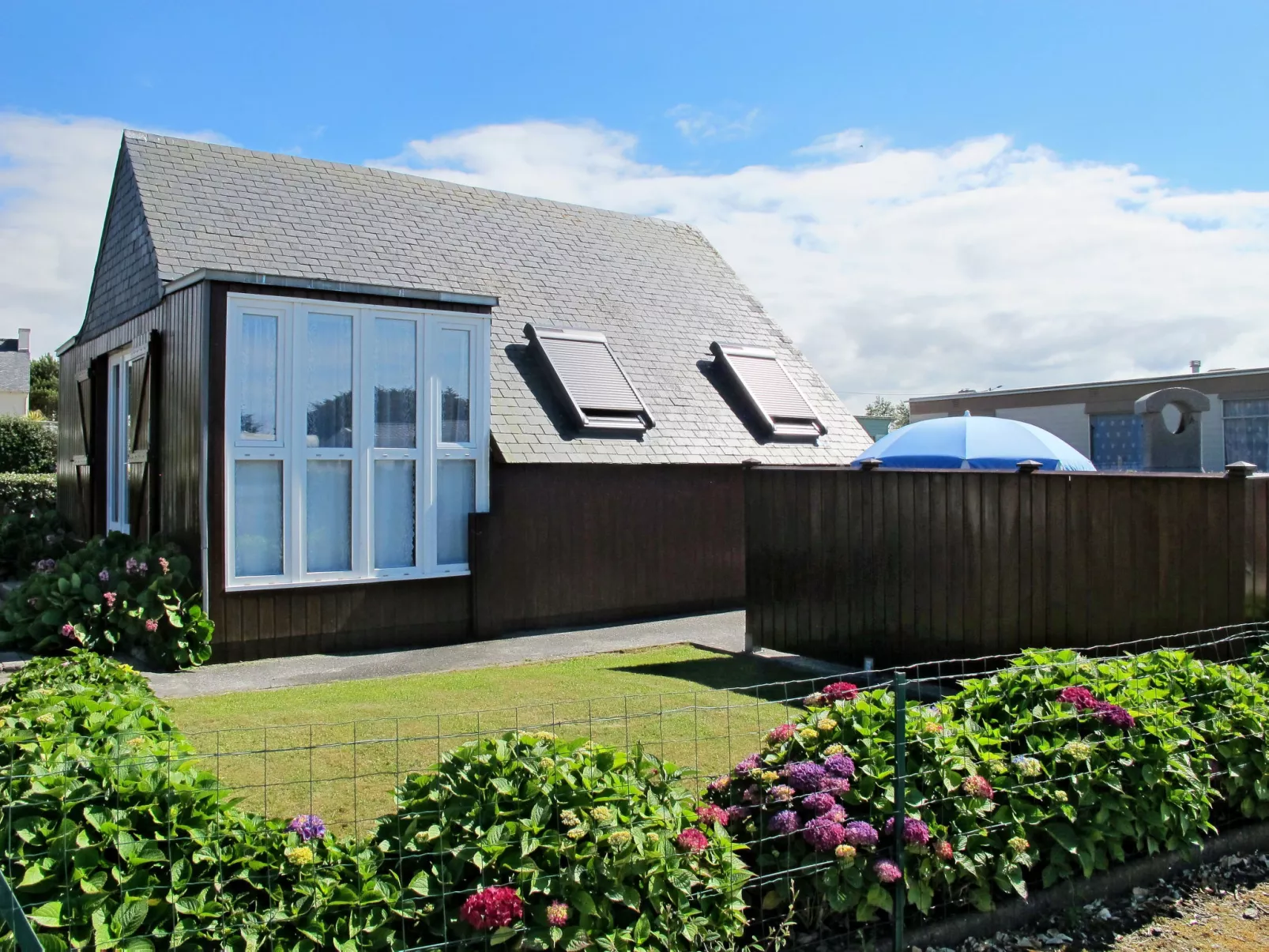 Petit Chalet à la Plage-Buiten