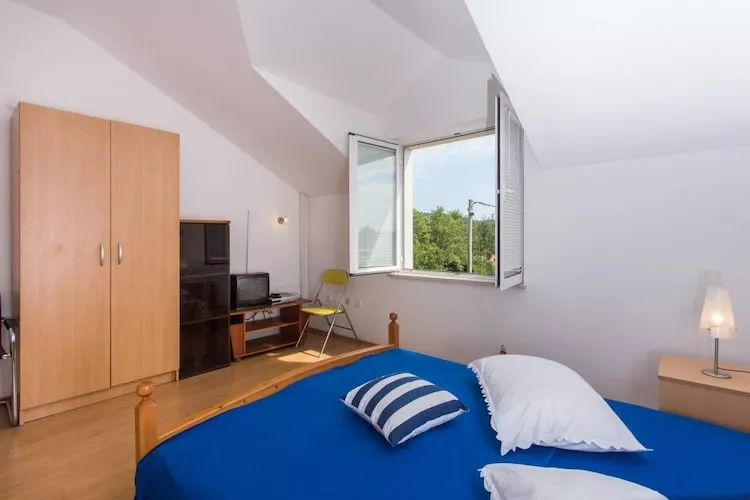Apartments Villa Maslina - Two Bedroom Apartment with Terrace and Garden View-Slaapkamer