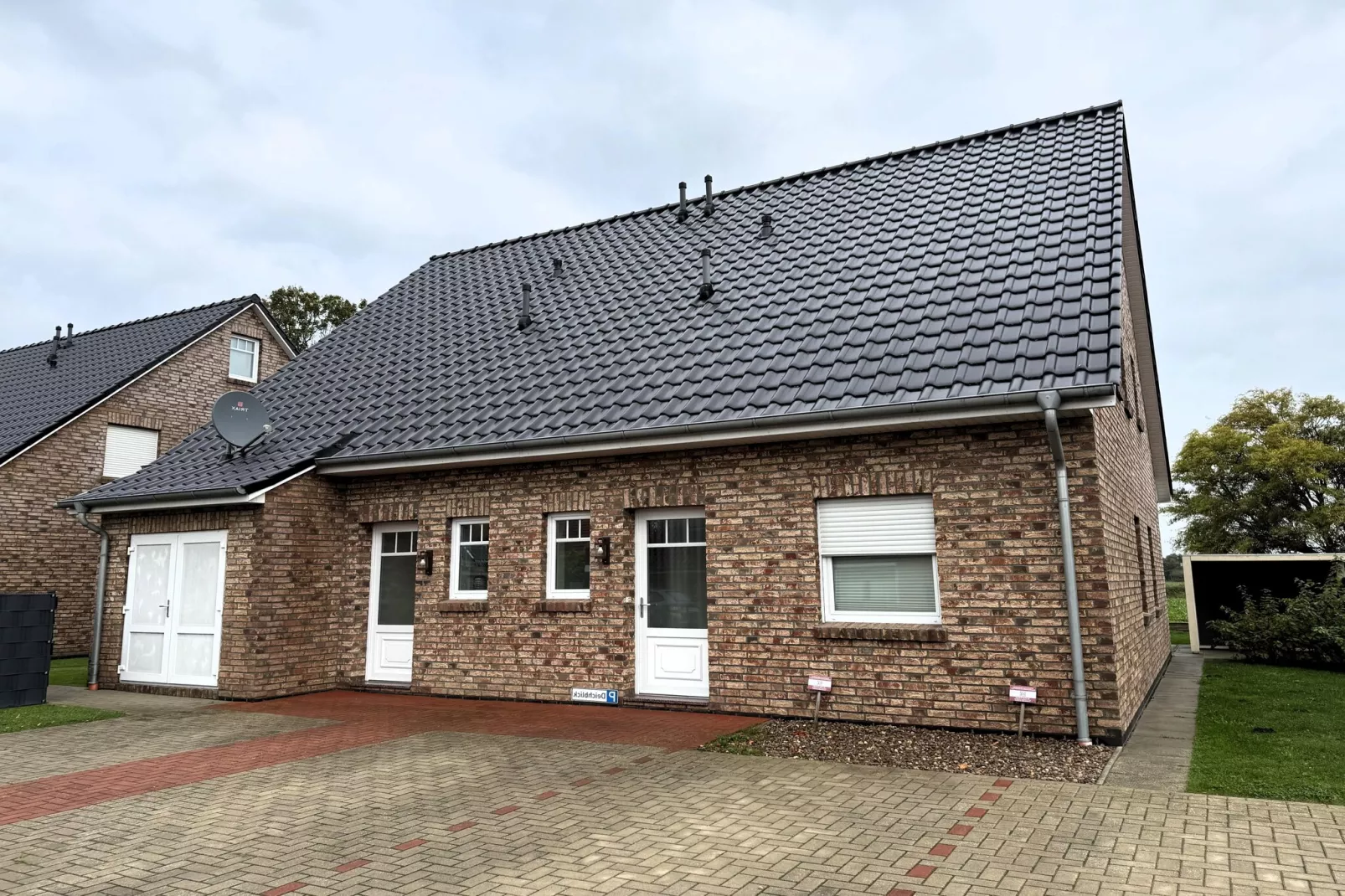 Gemütliche Nordsee-Wohnung in Neßmersiel mit Garten und Feldblick-Buitenkant zomer
