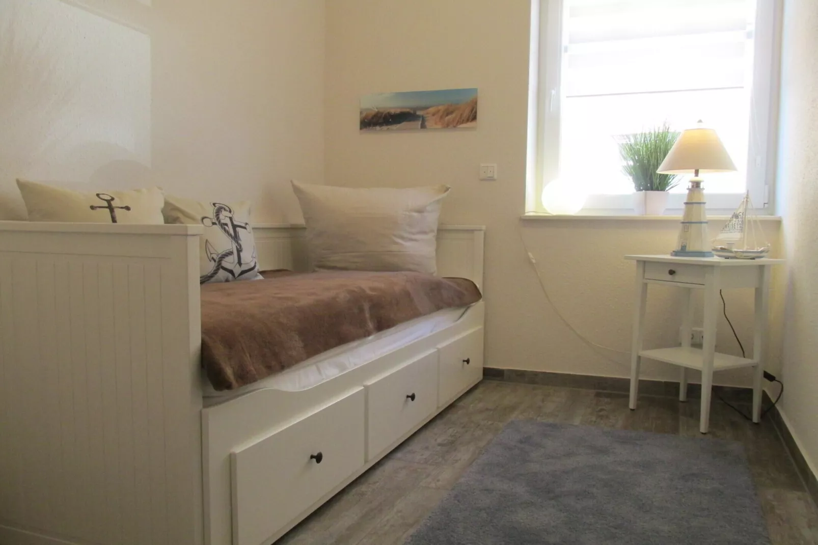 Gemütliche Nordsee-Wohnung in Neßmersiel mit Garten und Feldblick-Slaapkamer