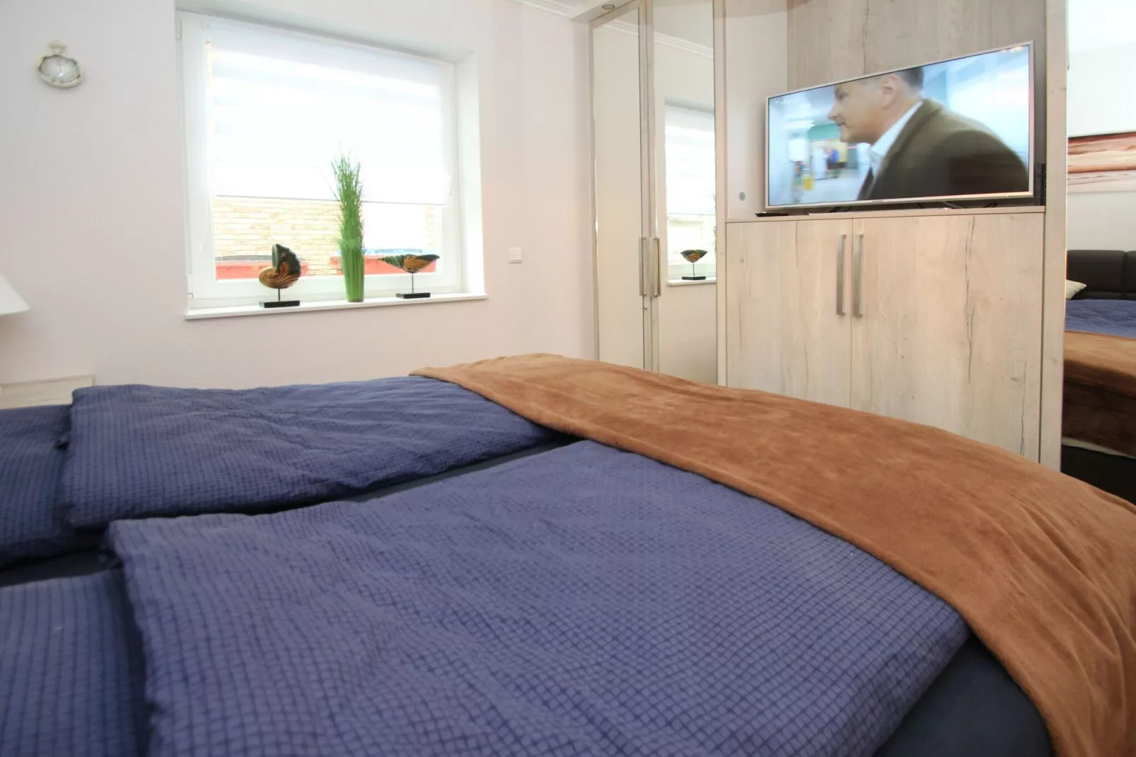 Gemütliche Nordsee-Wohnung in Neßmersiel mit Garten und Feldblick-Slaapkamer