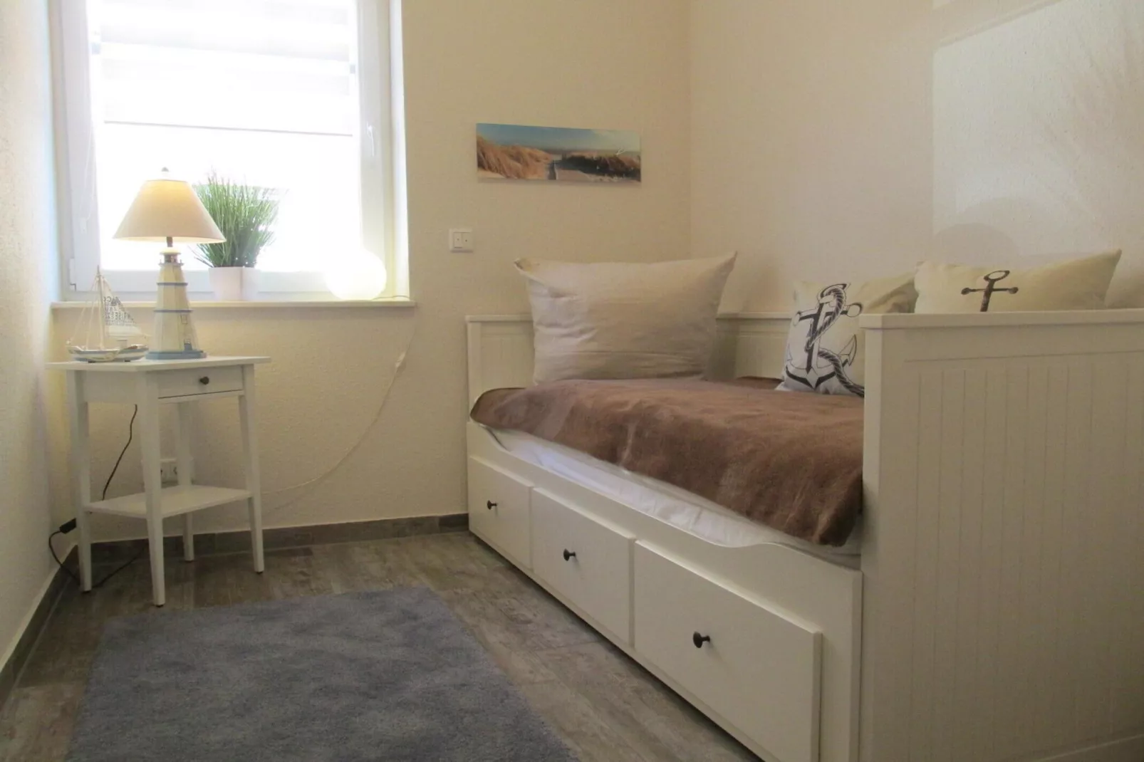 Gemütliche Nordsee-Wohnung in Neßmersiel mit Garten und Feldblick-Slaapkamer