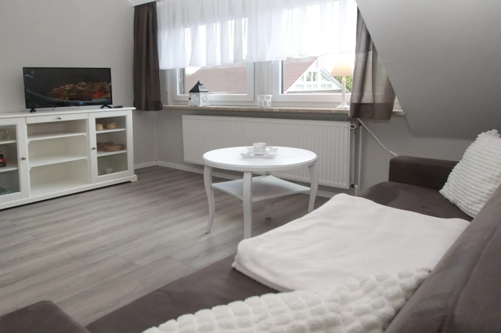 Ferienwohnung in Berumbur-Woonkamer