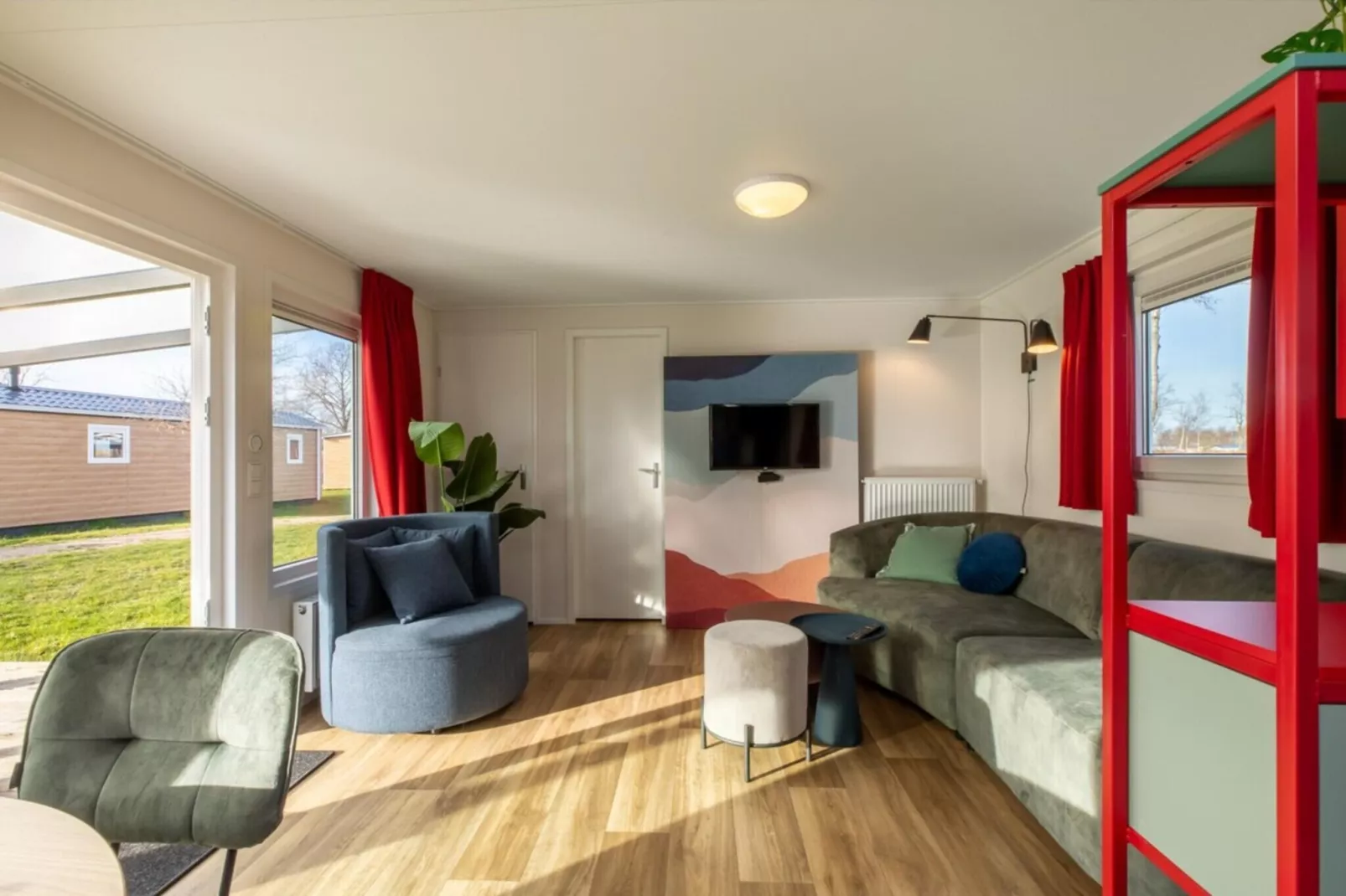 Chalet - Camping de Duinhoeve 'Bosdier'-Woonkamer