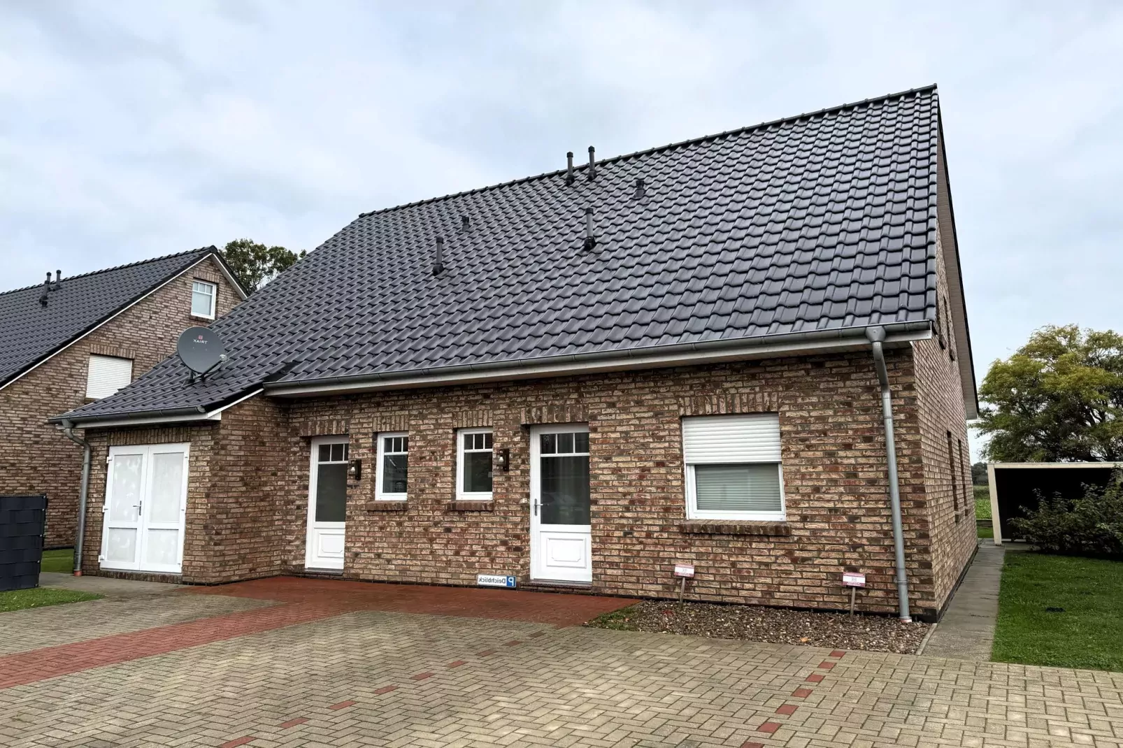 Gemütliche Nordsee-Wohnung in Neßmersiel mit Garten und Feldblick-Buitenkant zomer