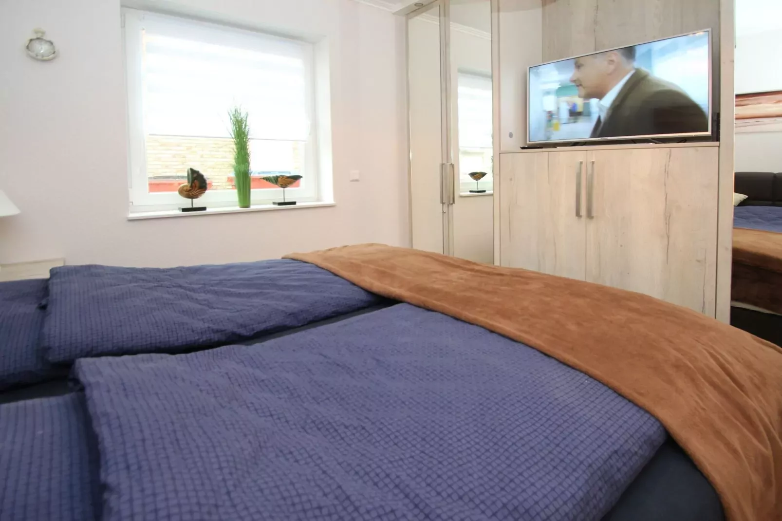 Gemütliche Nordsee-Wohnung in Neßmersiel mit Garten und Feldblick-Slaapkamer