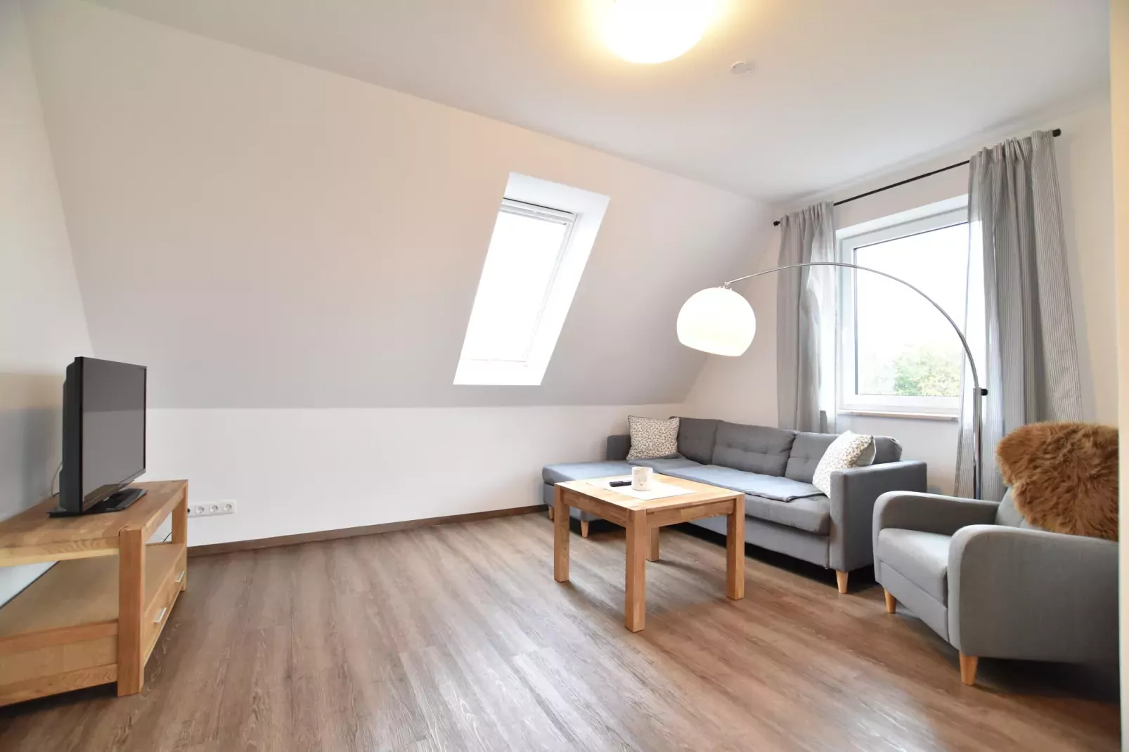 Ferienwohnung Gänseblümchen-Woonkamer