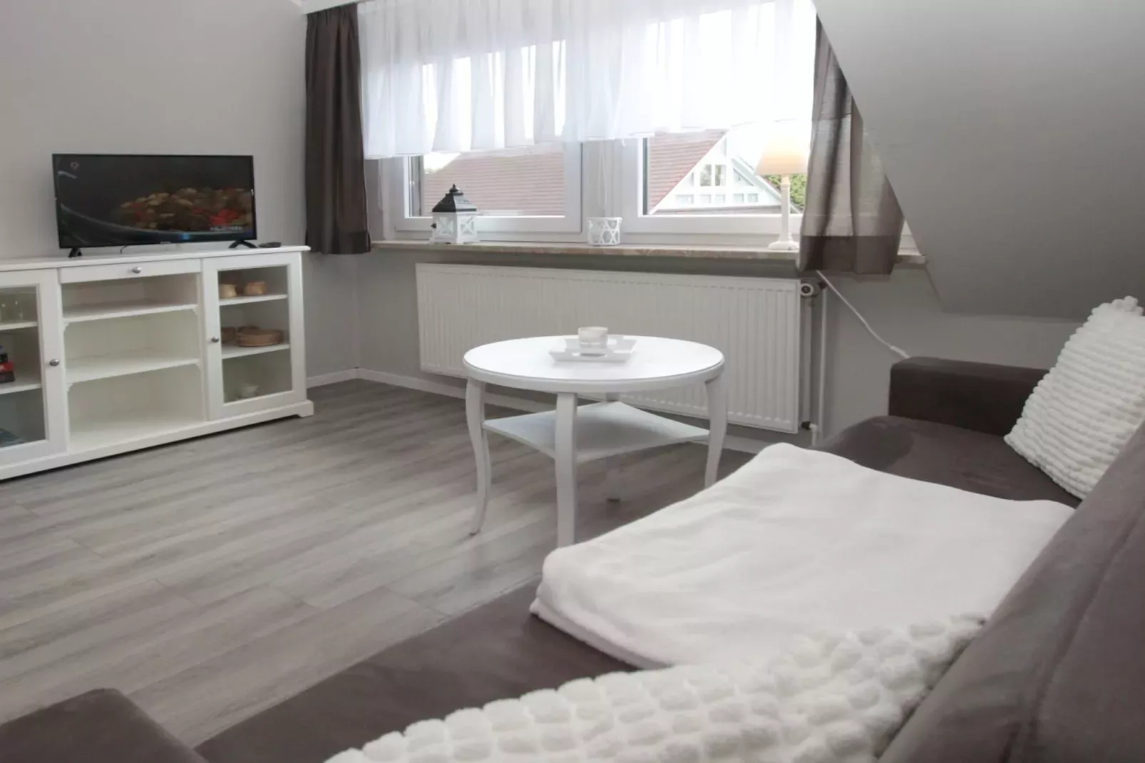 Ferienwohnung in Berumbur-Woonkamer