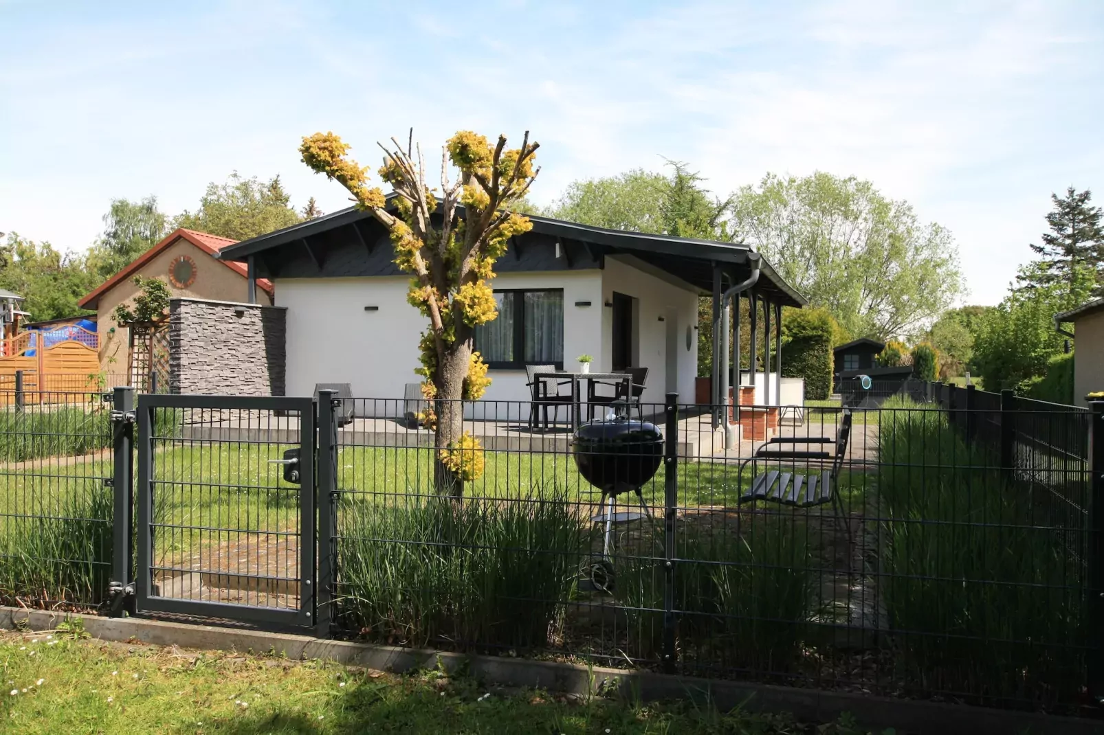 Ferienhaus mit Wasserblick 2 Pers-Buitenkant zomer