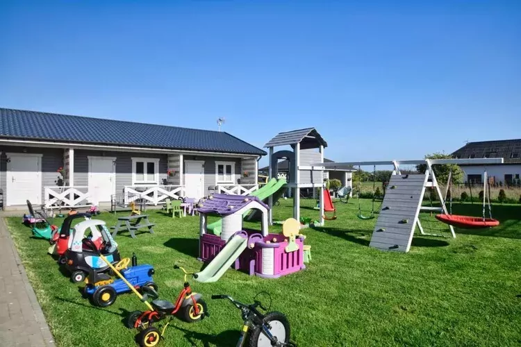 Parterowe domki wakacyjne dla 4 osób Sarbinowo-Tuinen zomer