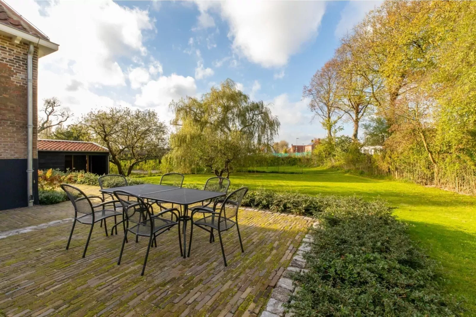 Vakantiehuis 'Boerderij Molenhof' - Stationsweg 5  Heinkenszand-Terrasbalkon
