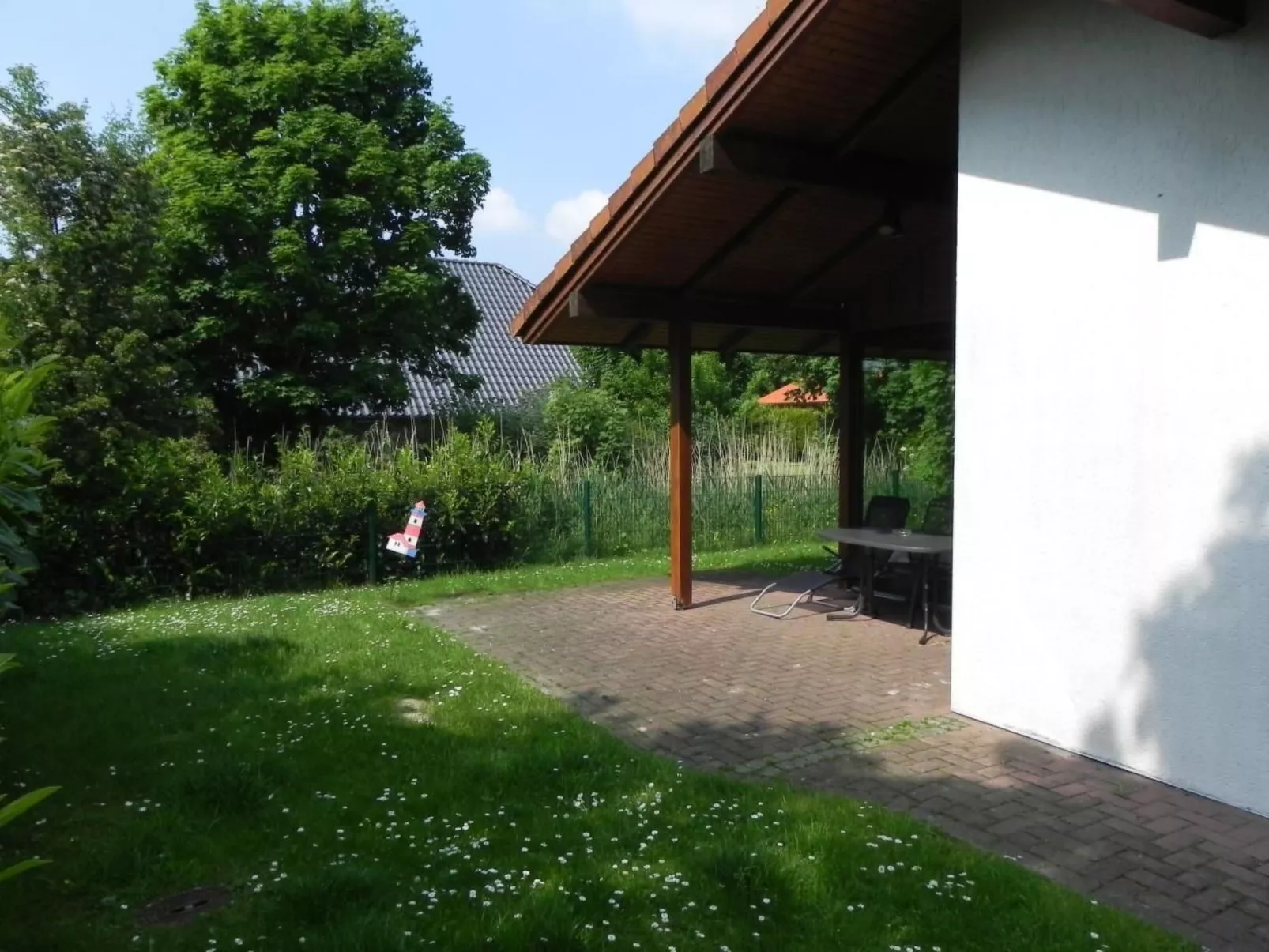 K5 Haus in Eckwarderhörne mit Terrasse und Garte - Buiten