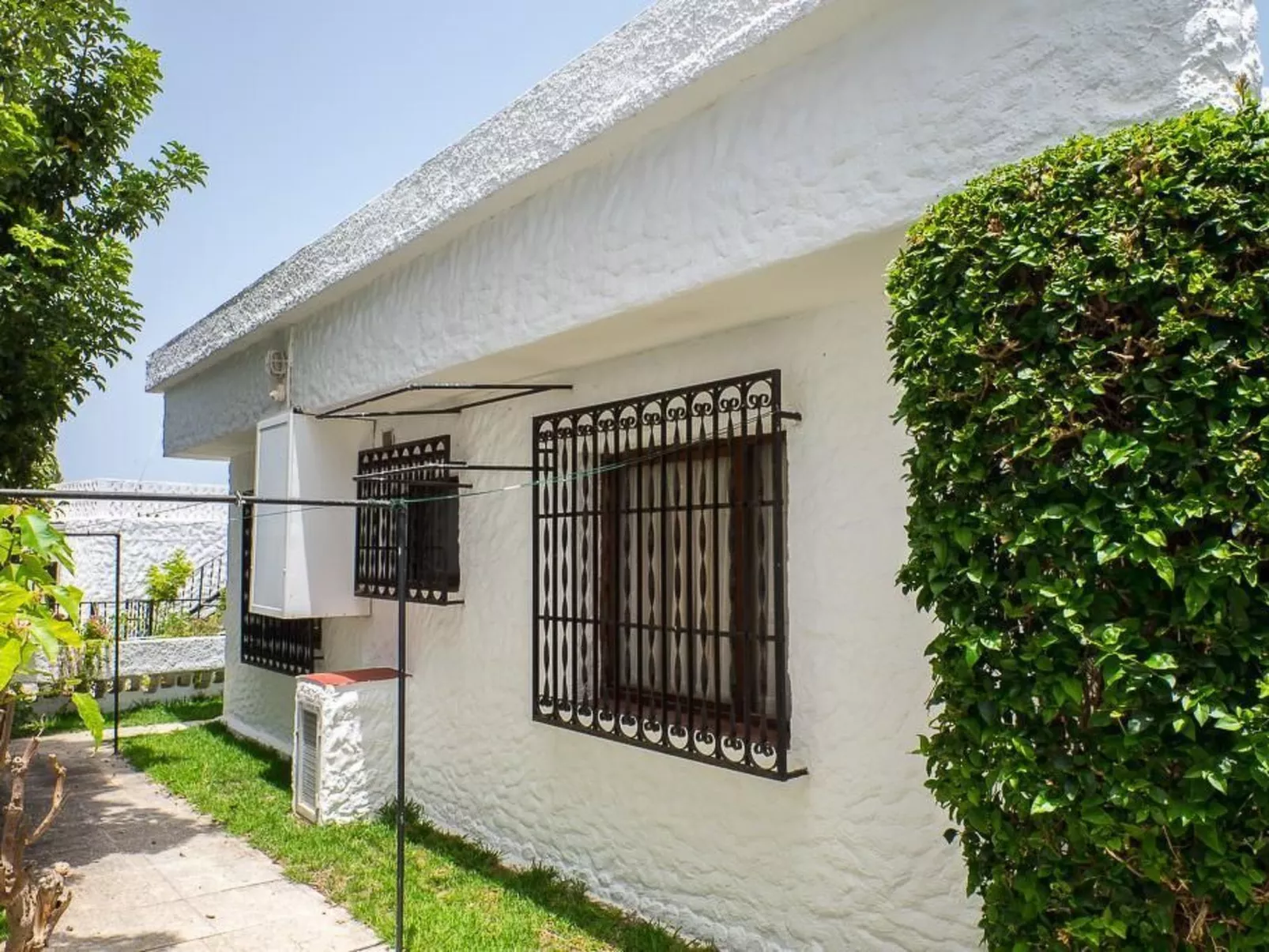 Strandnahes Haus mit Terrasse zum Sonnenuntergang - Buiten