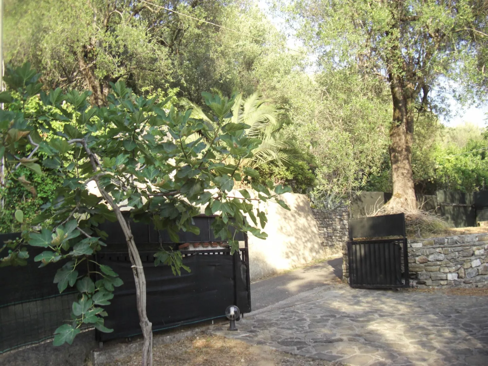 Strandnahe Ferienwohnung mit Garten und Grill - Buiten