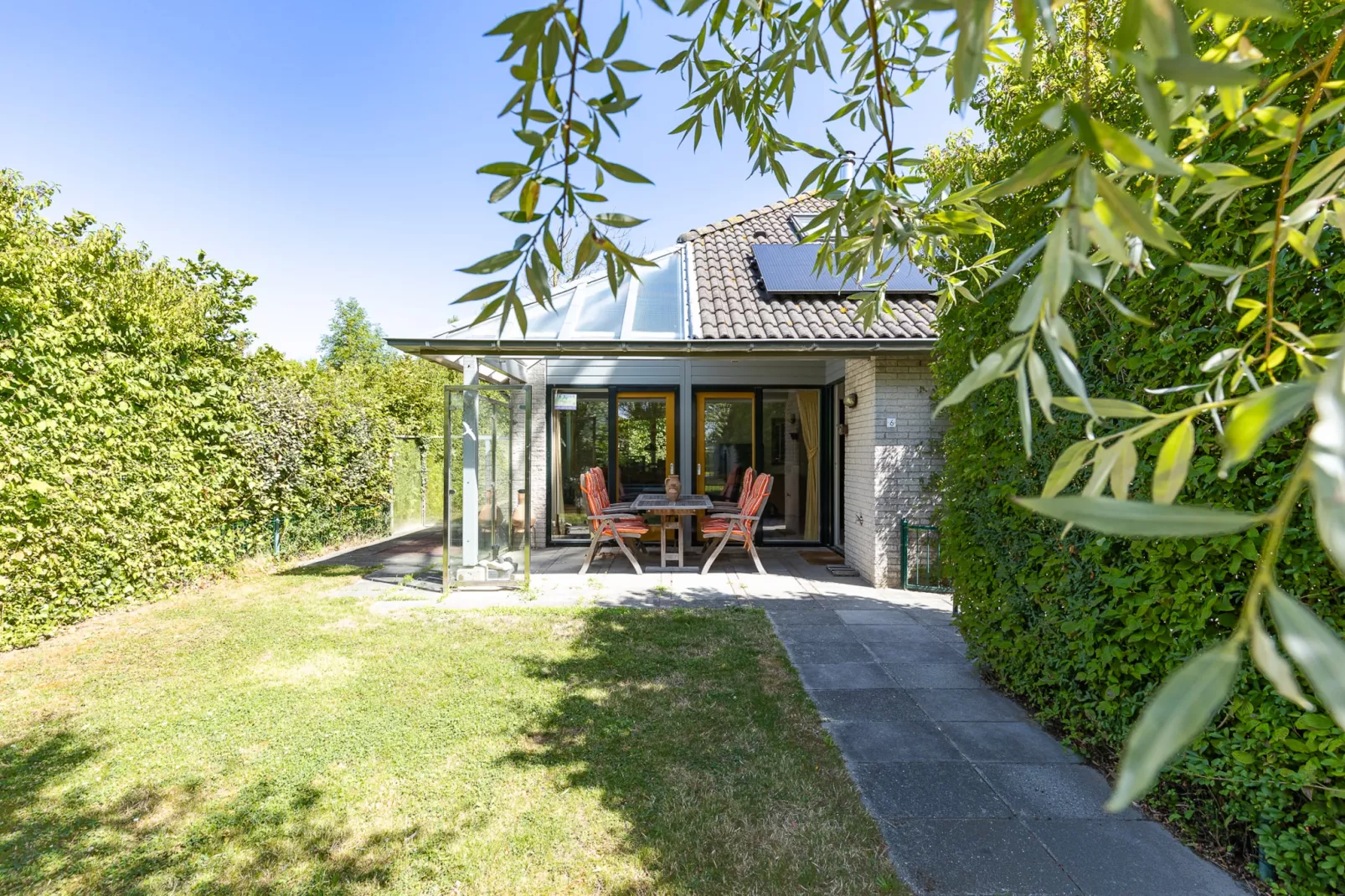 Vakantiewoning - Westduin 6 I Vlissingen 'Zilt en zand' - Tuinen zomer