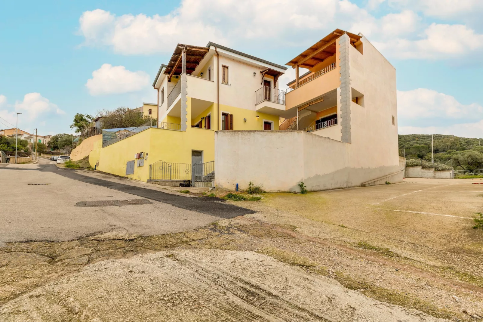 ATTICO BADESI CON PISCINA - Buitenkant zomer