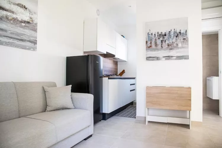Village Marina di Cortellazzo Lido di Jesolo Pineta Bungalow Superior - Woonkamer