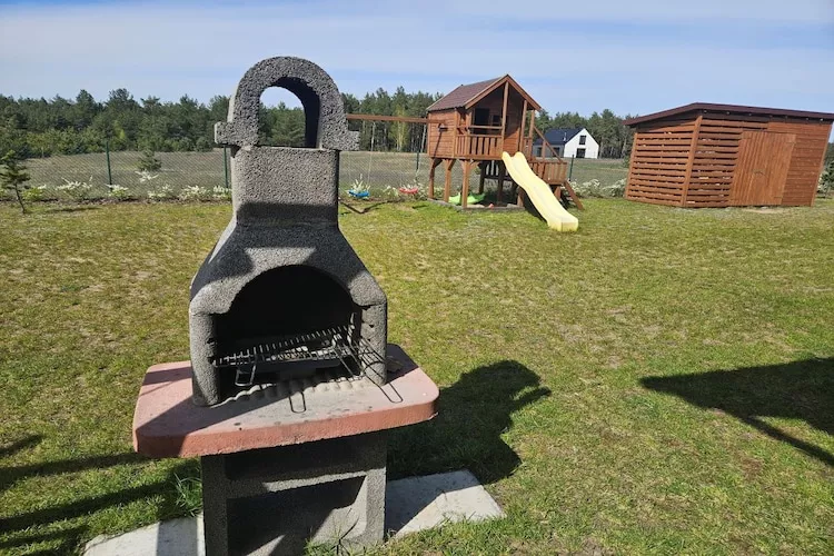 Dom wakacyjny bliźniak Wdzydze 1 - Tuinen zomer
