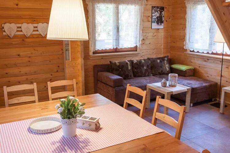 Drewniane domki wakacyjne Pobierowo-Woonkamer