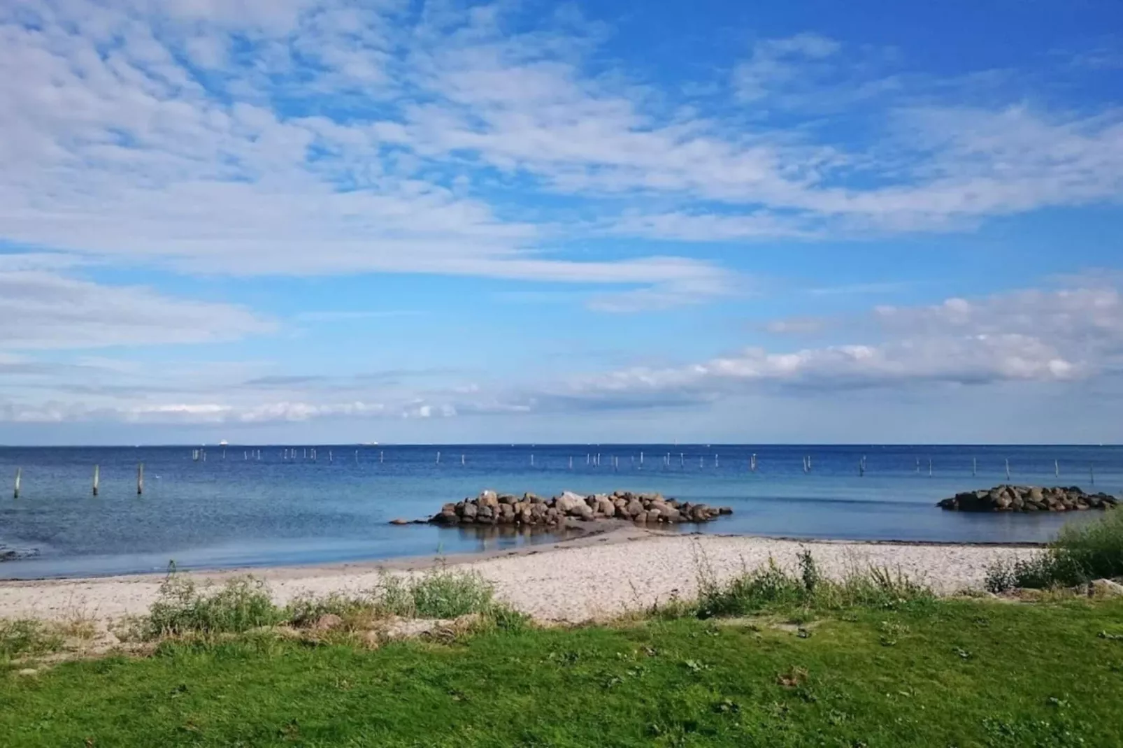 Vakantiehuis aan de kust met spa en sauna - Waterzicht
