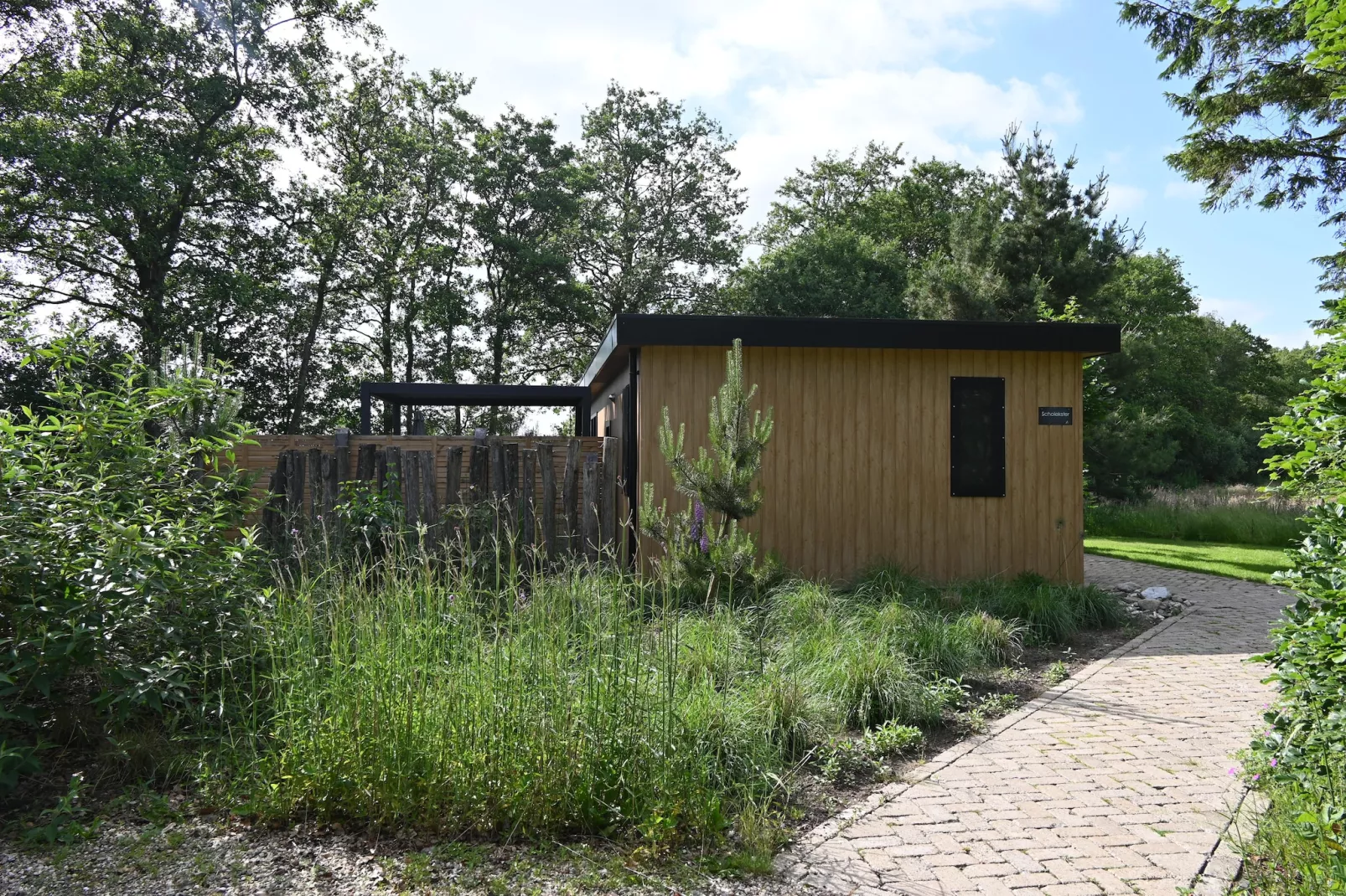 Wellnesslodge Scholekster 4p - Tuinen zomer