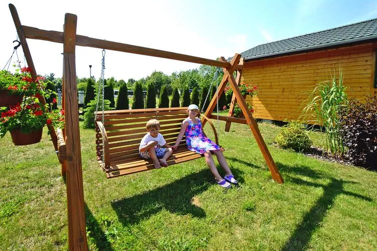 Domki letniskowe dla 5 osób Mielno-Tuinen zomer