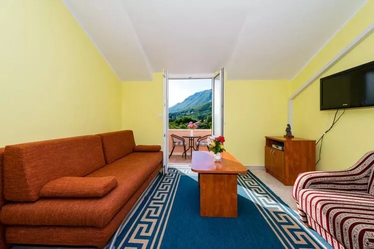 Apartments Azzurro- One Bedroom Apartment with Terrace and Hot Tub ( Azzurro II-gornji)-Woonkamer