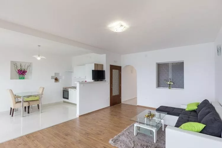 Apartments Manuela - One-Bedroom Apartment with Balcony and Sea View-Woonkamer
