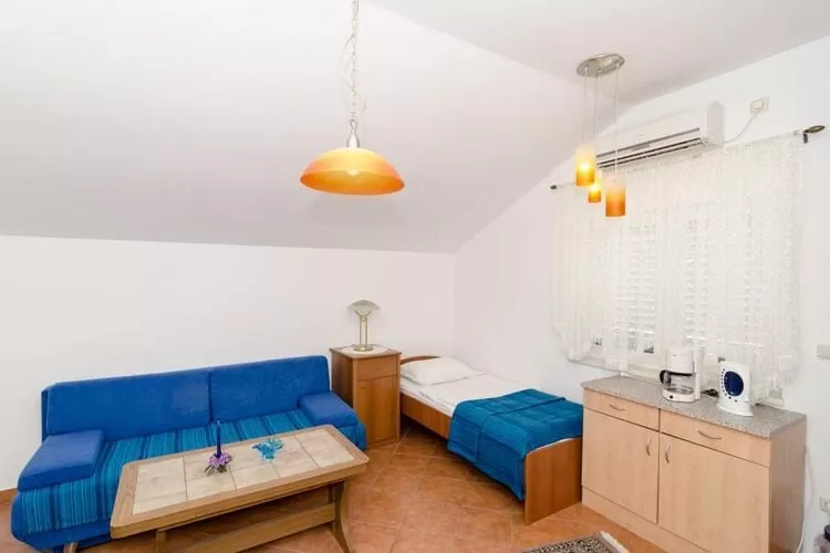 Apartments Peco - One Bedroom Apartment with Patio and Side Sea View-Woonkamer