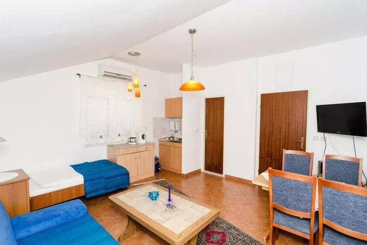 Apartments Peco - One Bedroom Apartment with Patio and Side Sea View-Woonkamer