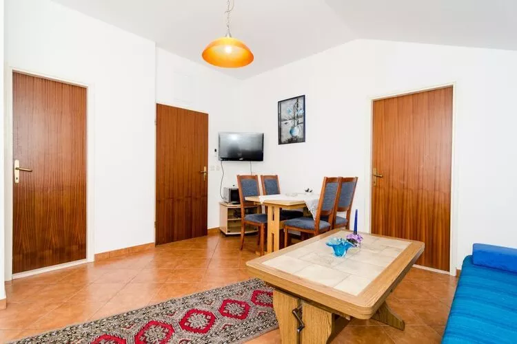 Apartments Peco - One Bedroom Apartment with Patio and Side Sea View-Woonkamer