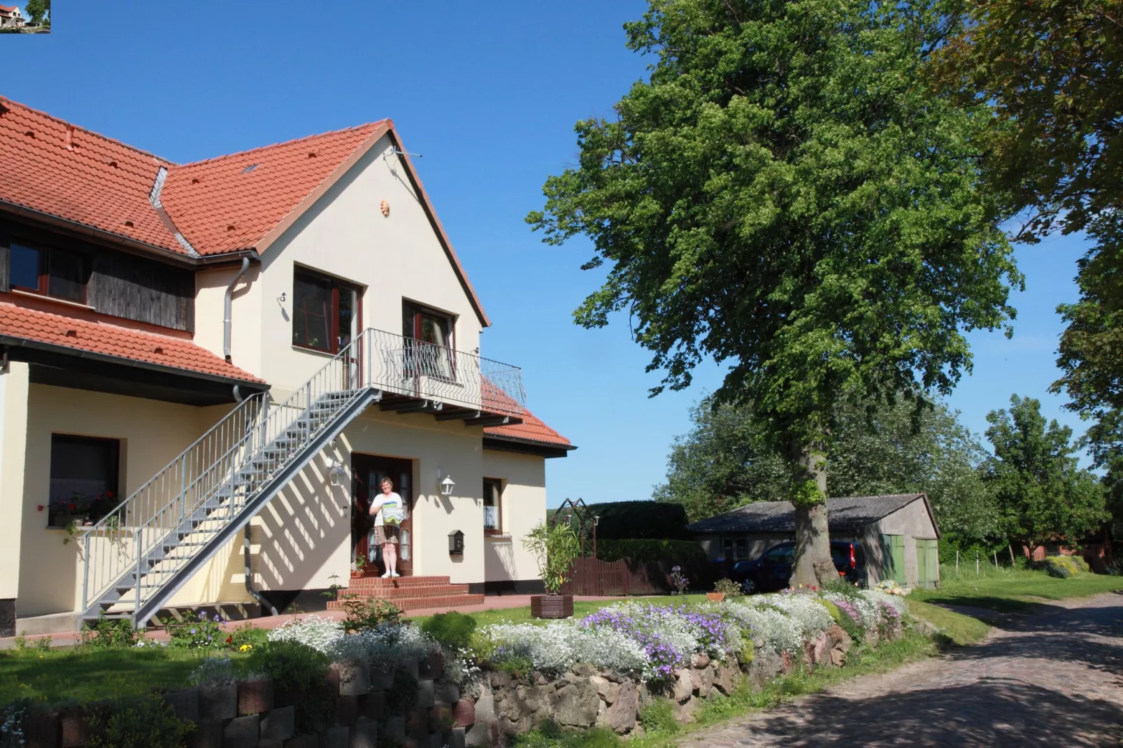 Ferienwohnung mit Gartenblick-Buitenkant zomer