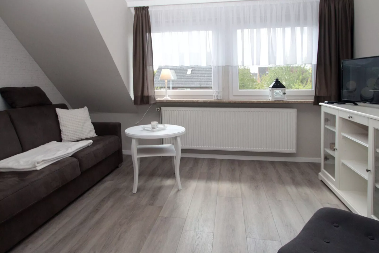 Ferienwohnung in Berumbur-Woonkamer