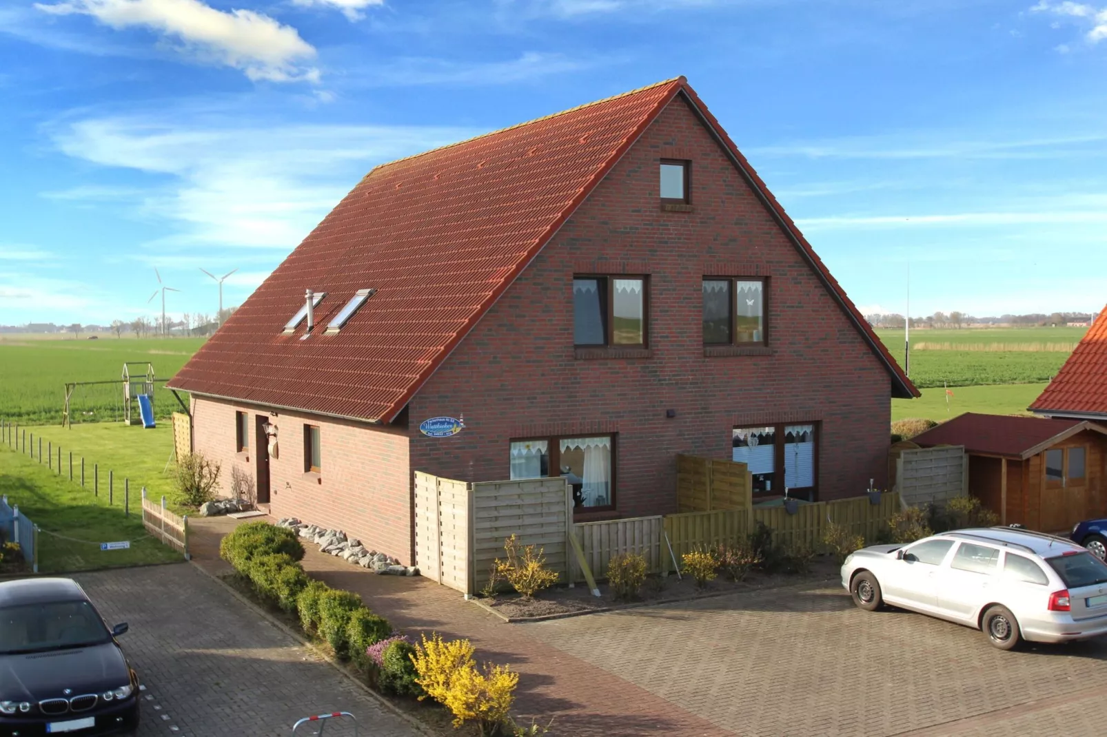 Fewo Wattkieker - Wattseite-Buitenkant zomer