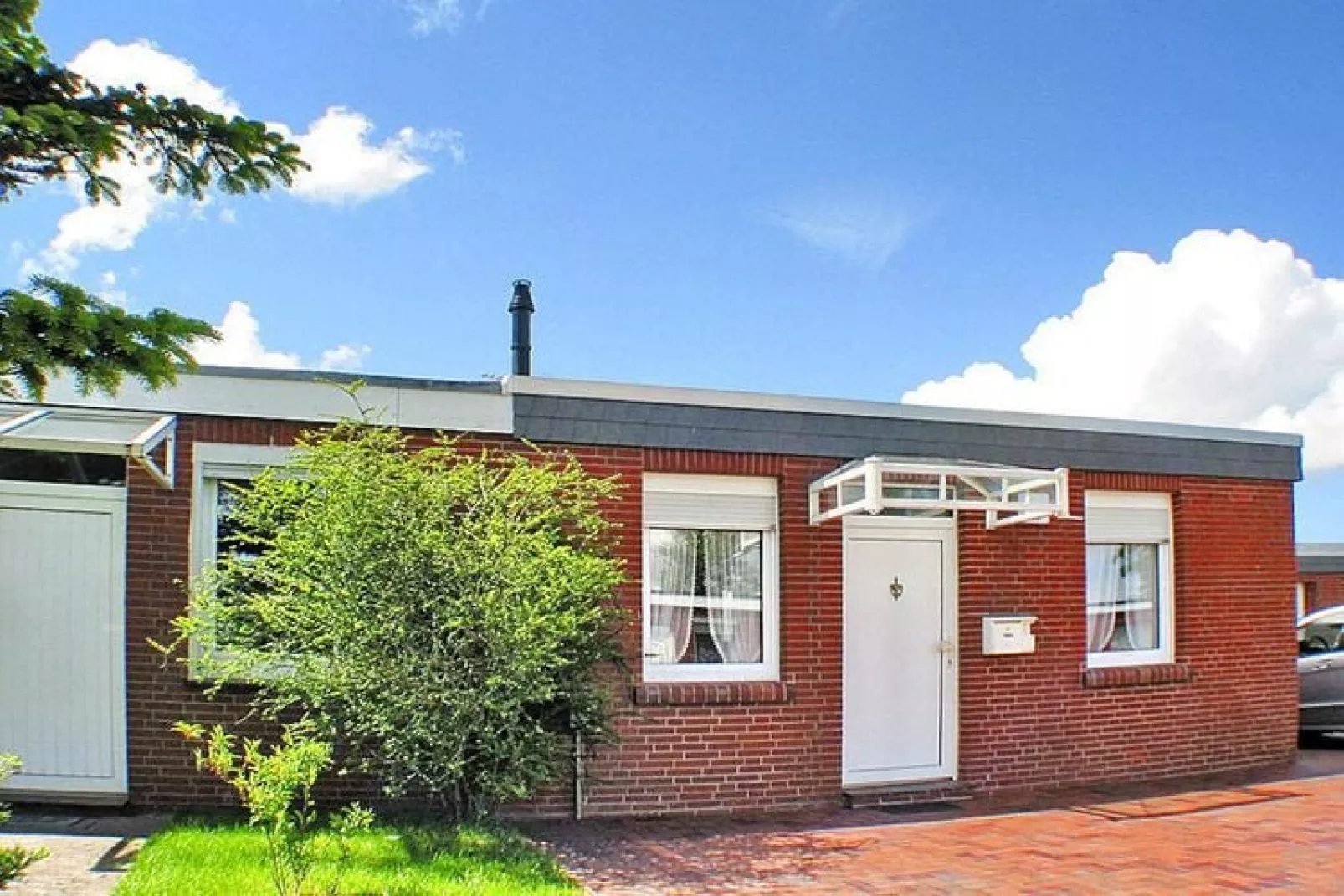 Ferienbungalow in Dornumersiel-Buitenkant zomer
