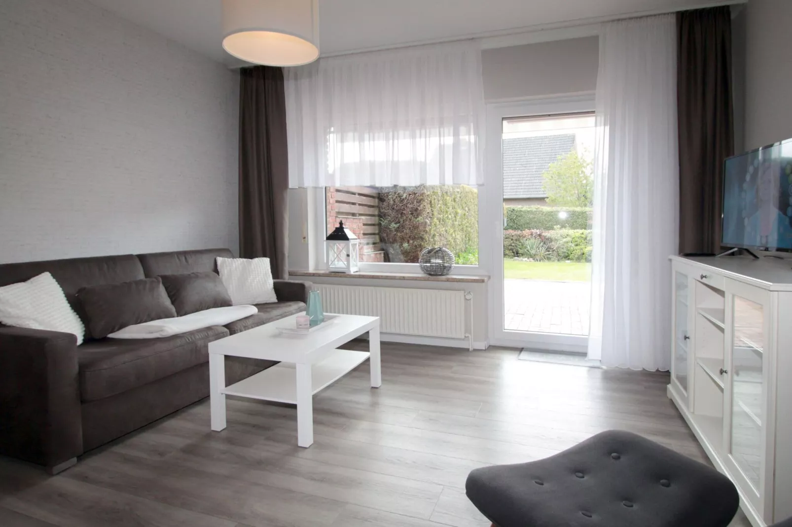 Ferienwohnung in Berumbur-Woonkamer