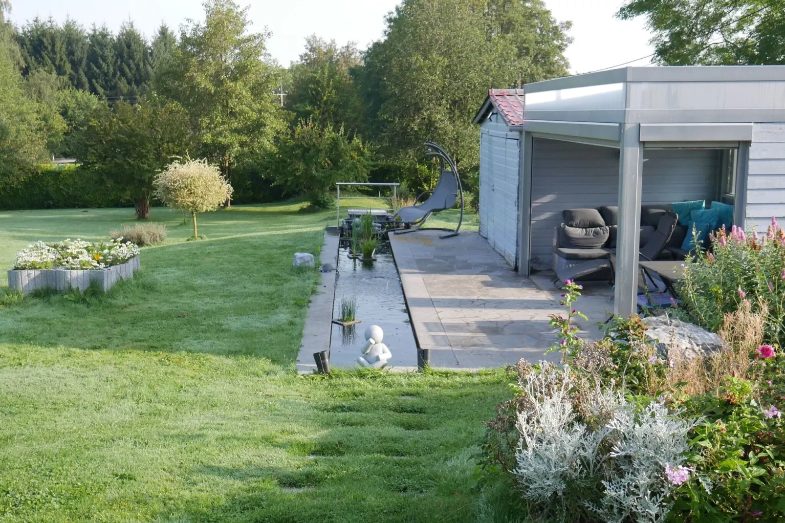 Charmante habitation située à la Reid avec Jacuzzi-Tuinen zomer