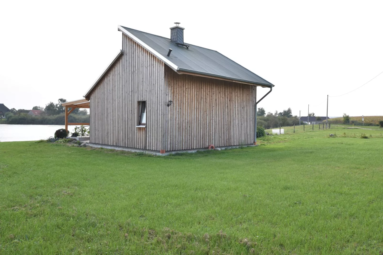 Ferienhaus Am See mit Kamin-Tuinen zomer