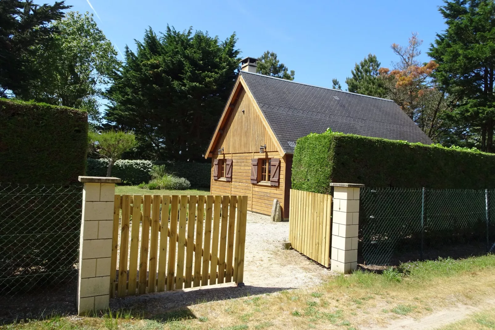 Holiday home Denneville-Buitenkant zomer
