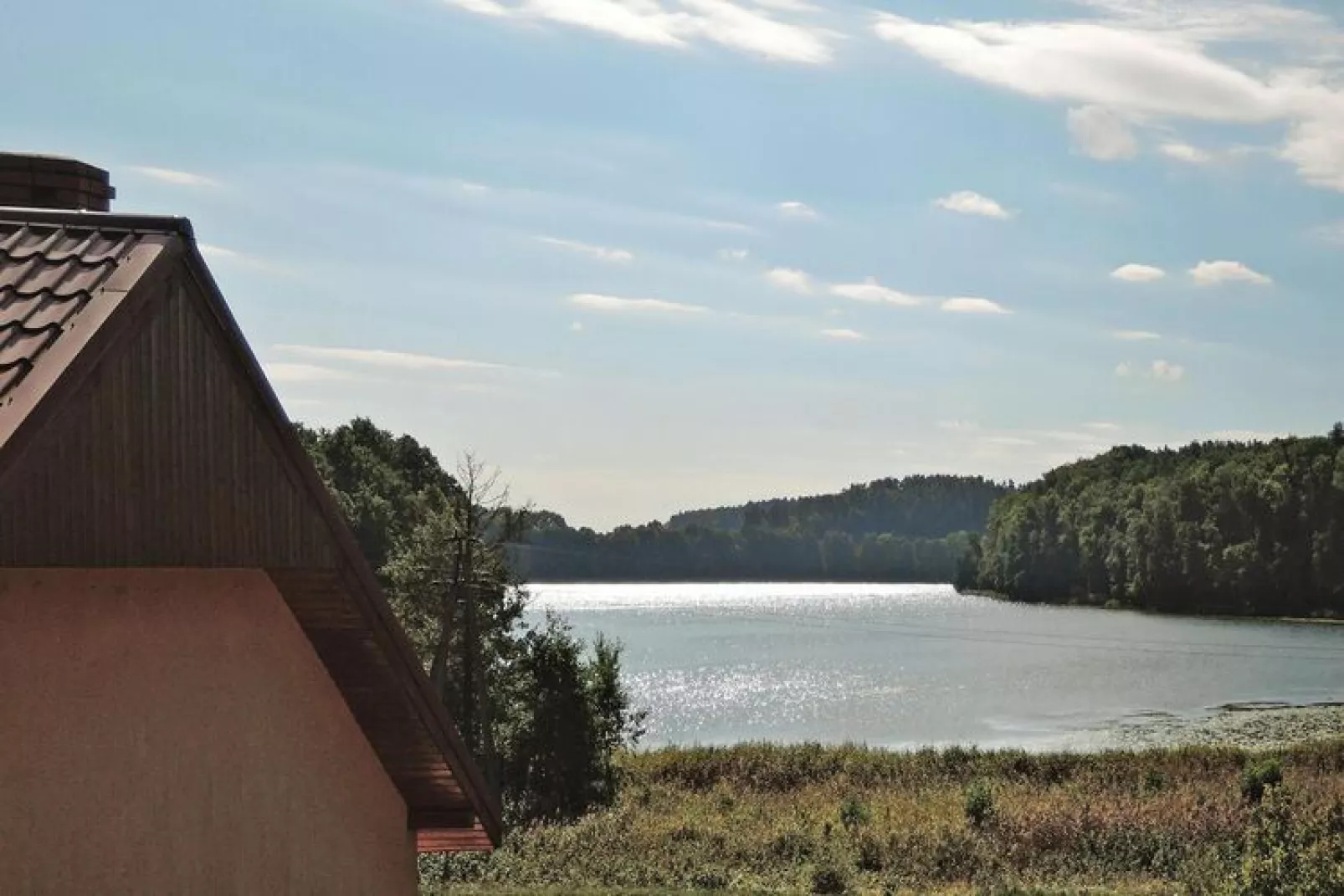 Holiday home at the lake Kolczewo WIE-Uitzicht zomer